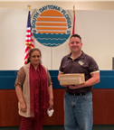 Ms. Laikha Aziz, Volusia Medical Supply, pictured with Les Gillis, City Manager